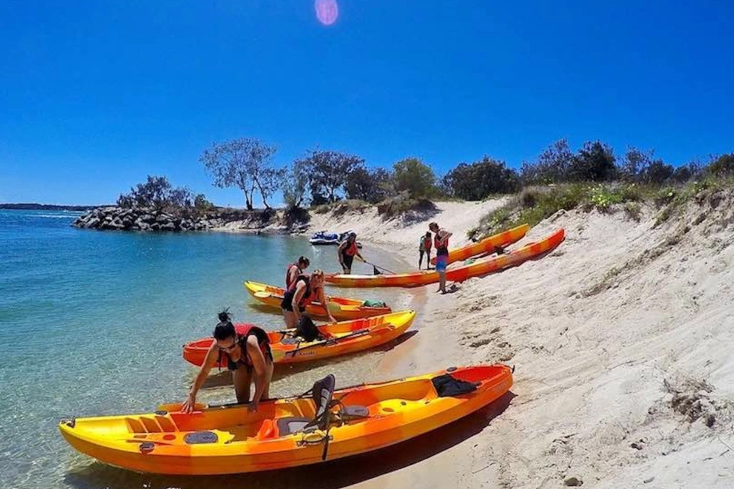 Australian Kayaking Adventures - 4 Australian Kayaking Adventures, Gold Coast - People with kayaks lined up on the beach shore, ready for their adventure.